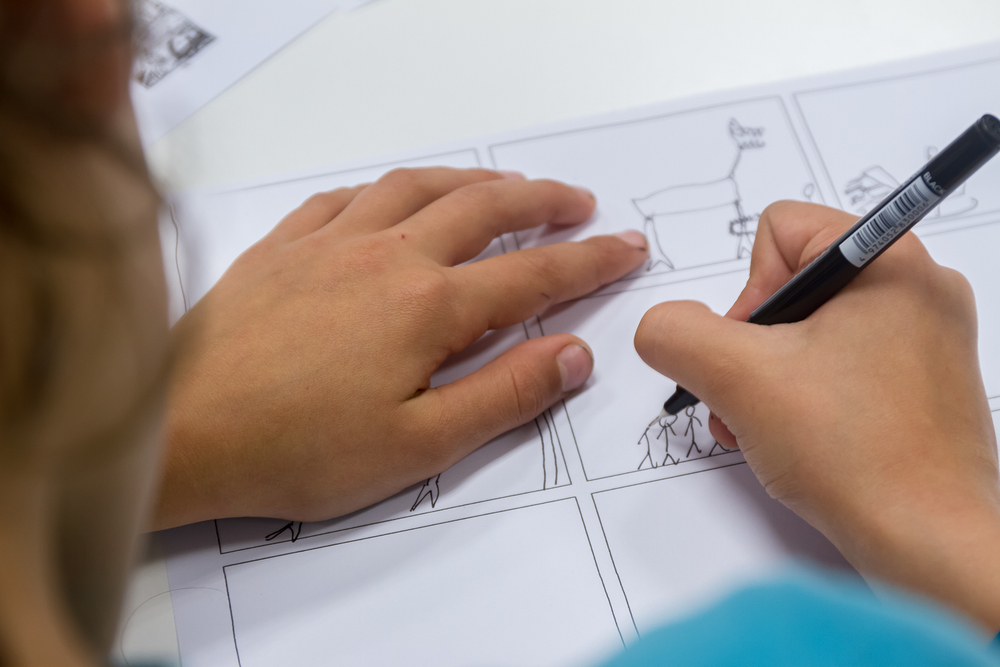 Child drawing a cartoon