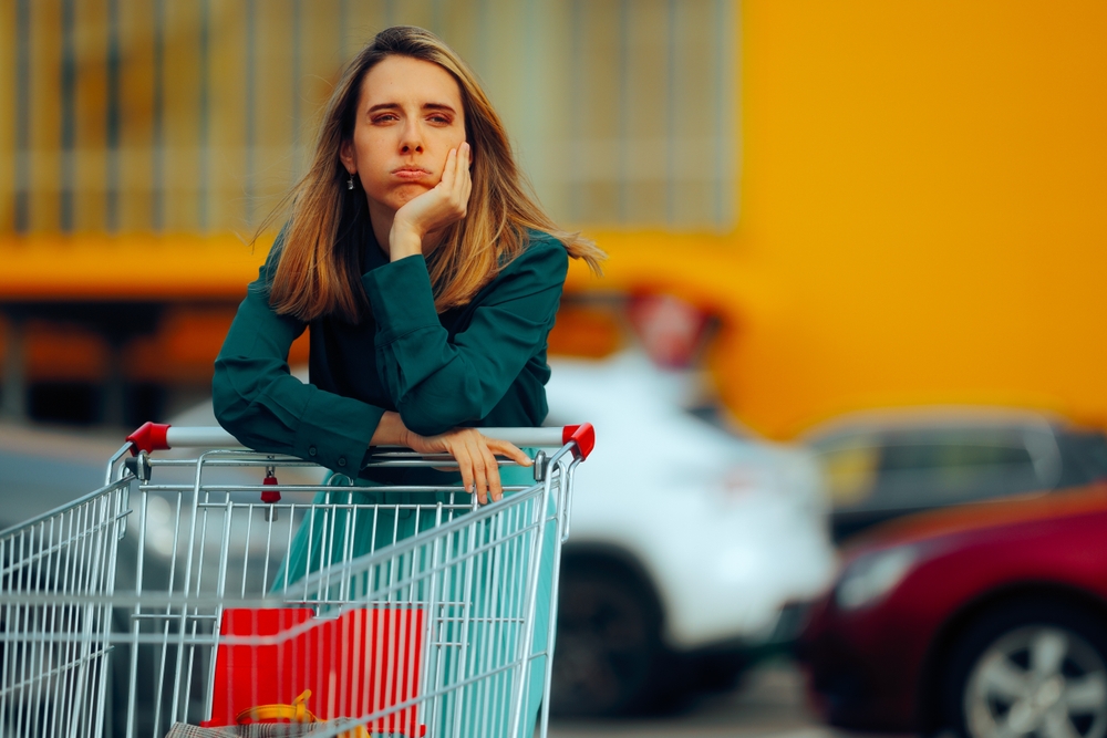 Tired and stressed woman going to the grocery store