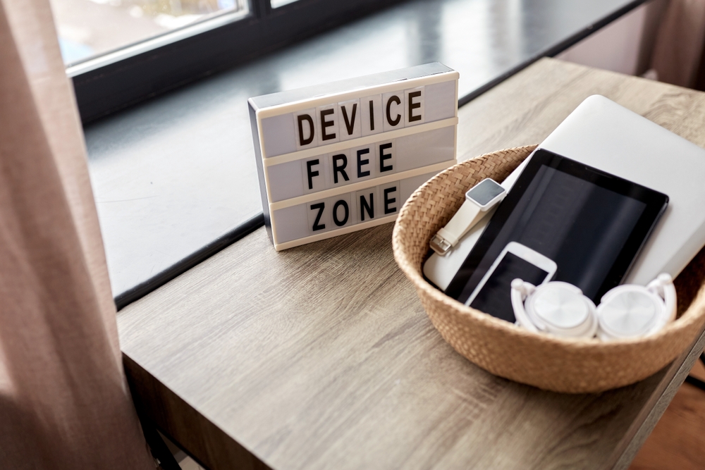 Device Free Zone for Less Stress (showing devices in a basket)